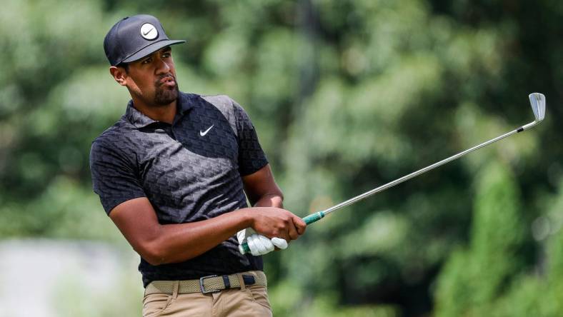 Tony Finau tees off for the par-3 9th green during Round 3 of the Rocket Mortgage Classic at the Detroit Golf Club in Detroit on Saturday, July 30, 2022.