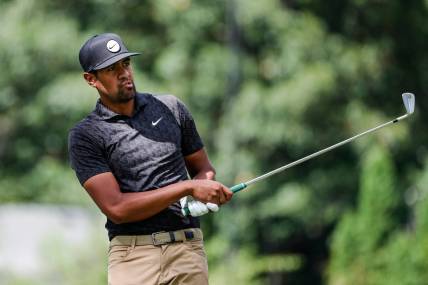 Tony Finau tees off for the par-3 9th green during Round 3 of the Rocket Mortgage Classic at the Detroit Golf Club in Detroit on Saturday, July 30, 2022.