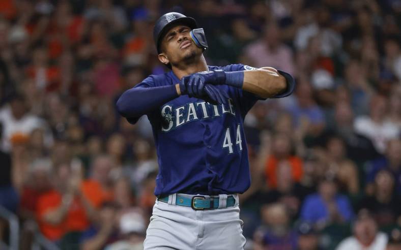 Jul 30, 2022; Houston, Texas, USA; Seattle Mariners center fielder Julio Rodriguez (44) reacts after an apparent injury during the eighth inning against the Houston Astros at Minute Maid Park. Mandatory Credit: Troy Taormina-USA TODAY Sports