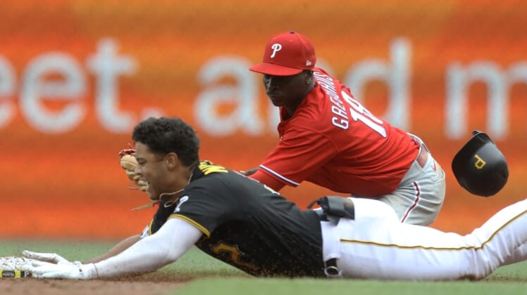 Jul 31, 2022; Pittsburgh, Pennsylvania, USA; Pittsburgh Pirates designated hitter Cal Mitchell (31) slides into second base for an RBI double as Philadelphia Phillies shortstop Didi Gregorius (18) looks to make a tag during the third inning at PNC Park. Mandatory Credit: Charles LeClaire-USA TODAY Sports