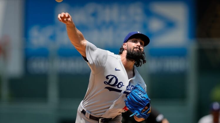 Jul 31, 2022; Denver, Colorado, USA; Los Angeles Dodgers starting pitcher Tony Gonsolin (26) pitches in the first inning against the Colorado Rockies at Coors Field. Mandatory Credit: Isaiah J. Downing-USA TODAY Sports