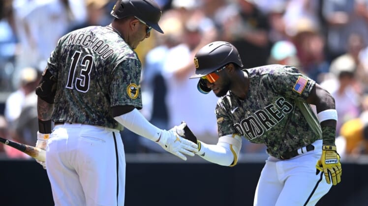 Jul 31, 2022; San Diego, California, USA; San Diego Padres left fielder Jurickson Profar (right) is congratulated by third baseman Manny Machado (13) after hitting a home run during the third inning against the San Diego Padres at Petco Park. Mandatory Credit: Orlando Ramirez-USA TODAY Sports