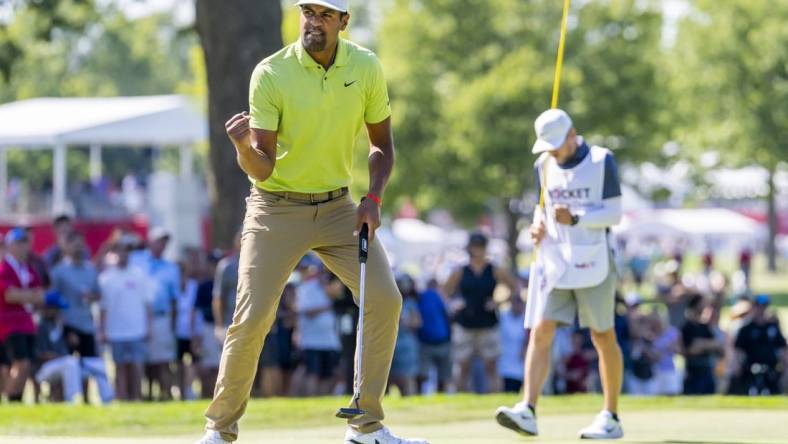 Jul 31, 2022; Detroit, Michigan, USA; Tony Finau pumps his fist after making birdie on the par 4 twelfth hole during the final round of the Rocket Mortgage Classic golf tournament. Mandatory Credit: Raj Mehta-USA TODAY Sports