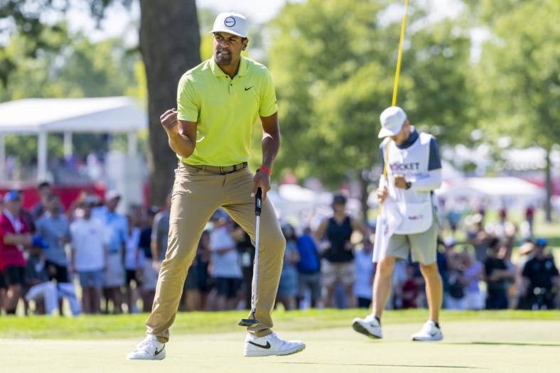 Jul 31, 2022; Detroit, Michigan, USA; Tony Finau pumps his fist after making birdie on the par 4 twelfth hole during the final round of the Rocket Mortgage Classic golf tournament. Mandatory Credit: Raj Mehta-USA TODAY Sports