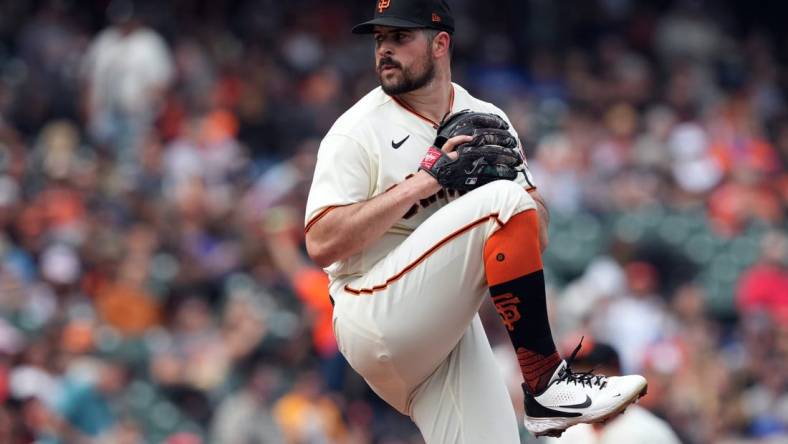 Jul 31, 2022; San Francisco, California, USA; San Francisco Giants starting pitcher Carlos Rodon (16) throws a pitch against the Chicago Cubs during the first inning at Oracle Park. Mandatory Credit: Darren Yamashita-USA TODAY Sports