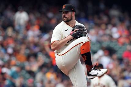 Jul 31, 2022; San Francisco, California, USA; San Francisco Giants starting pitcher Carlos Rodon (16) throws a pitch against the Chicago Cubs during the first inning at Oracle Park. Mandatory Credit: Darren Yamashita-USA TODAY Sports