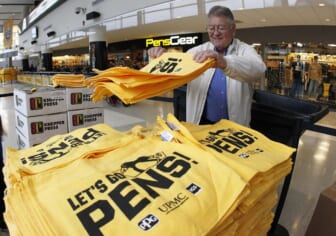 Apr 14, 2019; Pittsburgh, PA, USA;  Workers prepare rally towels to be handed out to fans before the Pittsburgh Penguins host the New York Islanders in game three of the first round of the 2019 Stanley Cup Playoffs at PPG PAINTS Arena. Mandatory Credit: Charles LeClaire-USA TODAY Sports