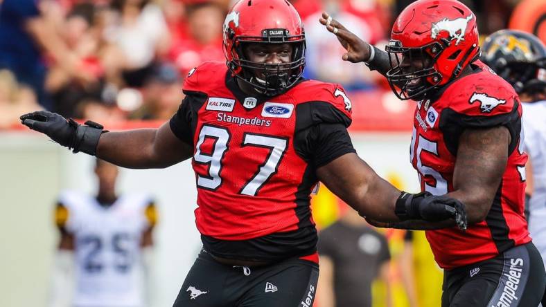 Sep 14, 2019; Calgary, Alberta, CAN; Calgary Stampeders defensive lineman Derek Wiggan (97) reacts in the second half against the Hamilton Tiger-Cats during a Canadian Football League game at McMahon Stadium. Mandatory Credit: Sergei Belski-USA TODAY Sports