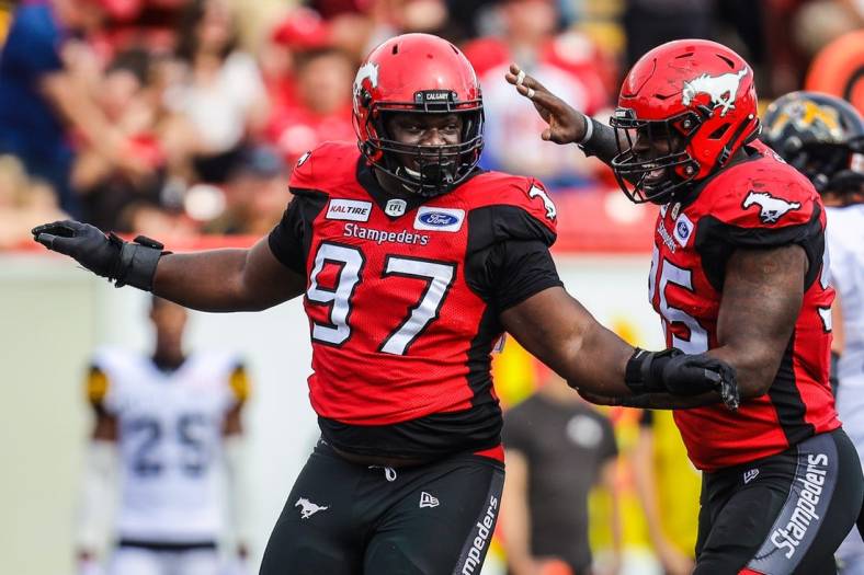 Sep 14, 2019; Calgary, Alberta, CAN; Calgary Stampeders defensive lineman Derek Wiggan (97) reacts in the second half against the Hamilton Tiger-Cats during a Canadian Football League game at McMahon Stadium. Mandatory Credit: Sergei Belski-USA TODAY Sports
