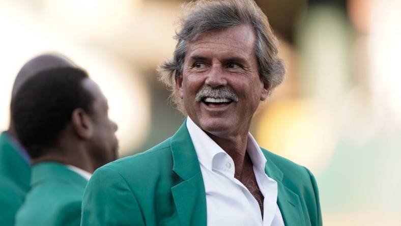 Sep 21, 2019; Oakland, CA, USA; Retired Oakland Athletics pitcher Dennis Eckersley smiles at the crowd before the game against the Texas Rangers at the Oakland Coliseum. Mandatory Credit: Stan Szeto-USA TODAY Sports