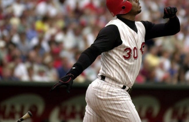 JUNE 26, 2000: Ken Griffey Jr. watches his ball fly over the fence for a 2-run home run in the first inning against the St. Louis Cardinals Monday at Cinergy Field.Text 2000 06 26 08 02 Reds Sports Nikon Digital Image The Cincinnati Reds Ken Griffey Jr Watches His Ball Fly Over The Fence For A 2 Run Homerun Bringing In Teammate Dmitre Young In The 1st Inning Against The St Louis Cardinals Monday At Cinergy Field Jeff Swinger Cincinnati Enquirer Js