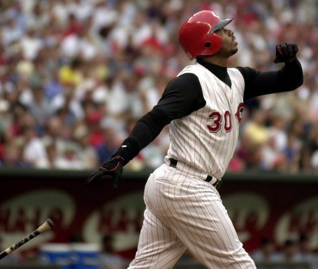 JUNE 26, 2000: Ken Griffey Jr. watches his ball fly over the fence for a 2-run home run in the first inning against the St. Louis Cardinals Monday at Cinergy Field.

Text 2000 06 26 08 02 Reds Sports Nikon Digital Image The Cincinnati Reds Ken Griffey Jr Watches His Ball Fly Over The Fence For A 2 Run Homerun Bringing In Teammate Dmitre Young In The 1st Inning Against The St Louis Cardinals Monday At Cinergy Field Jeff Swinger Cincinnati Enquirer Js