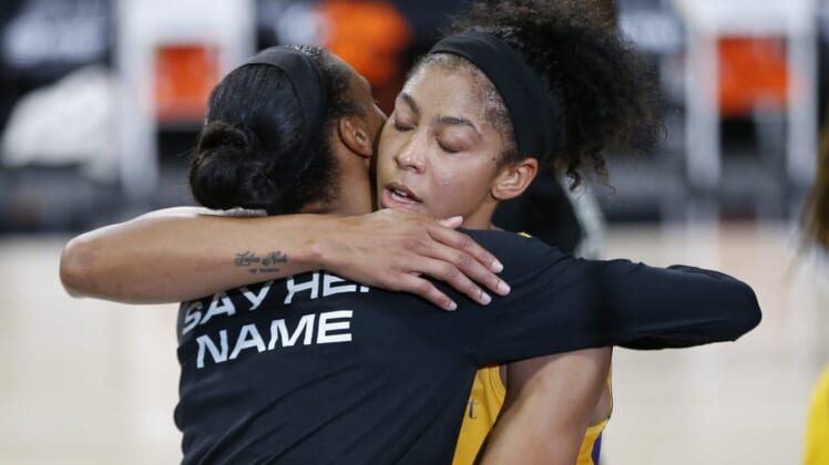 Sep 17, 2020; Palmetto, Florida, USA;  Los Angeles Sparks forward Candace Parker (3) and Connecticut Sun forward DeWanna Bonner (24) hug after the game at the FELD entertainment complex. Mandatory Credit: Reinhold Matay-USA TODAY Sports