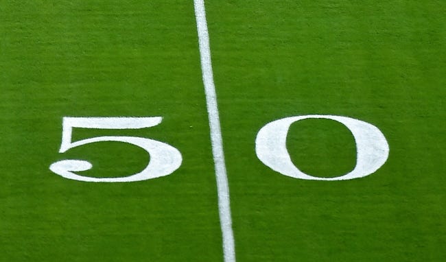 Sep 20, 2020; Miami Gardens, Florida, USA; A general view of the fifty yard line marking painted on the field at Hard Rock Stadium prior to the game between the Miami Dolphins and the Buffalo Bills. Mandatory Credit: Jasen Vinlove-USA TODAY Sports