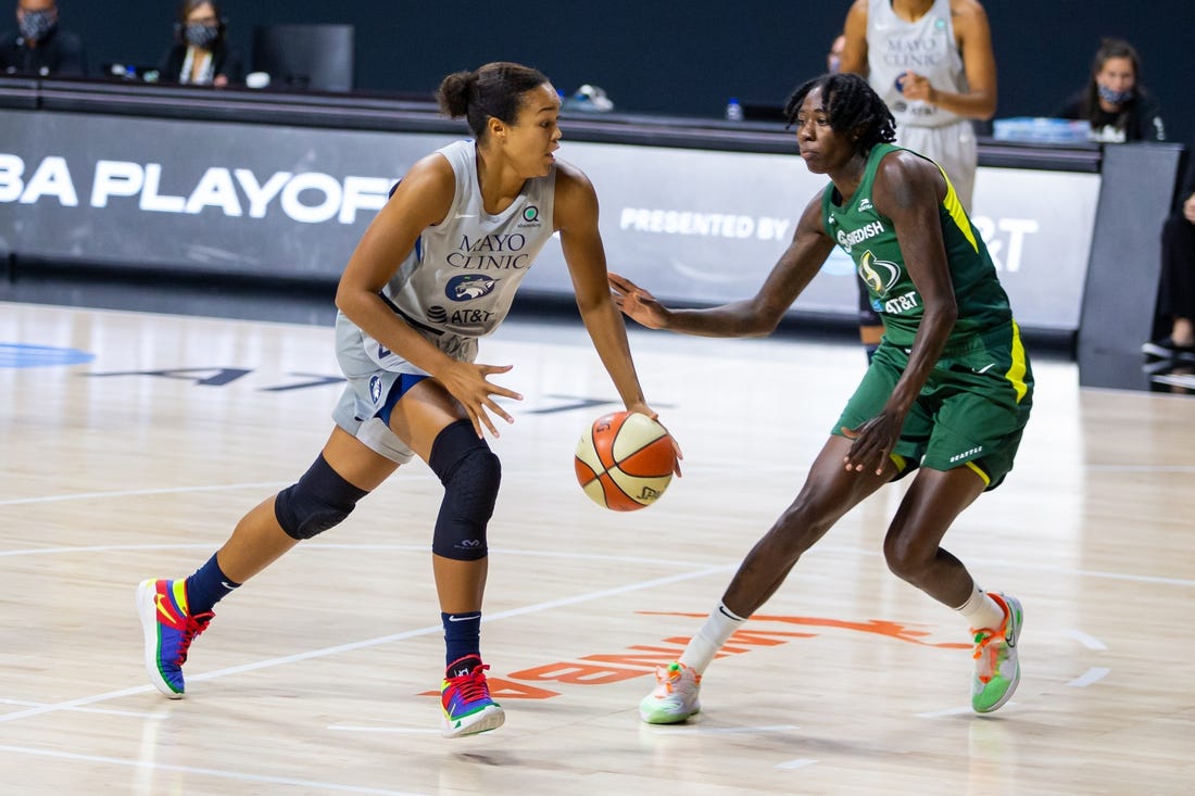 Sep 24, 2020; Bradenton, Florida, USA; Minnesota Lynx forward Napheesa Collier (24) drives past Seattle Storm forward Natasha Howard (6) during Game 2 of the WNBA Semifinals at Feld Entertainment. Mandatory Credit: Mary Holt-USA TODAY Sports