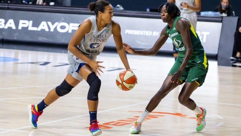 Sep 24, 2020; Bradenton, Florida, USA; Minnesota Lynx forward Napheesa Collier (24) drives past Seattle Storm forward Natasha Howard (6) during Game 2 of the WNBA Semifinals at Feld Entertainment. Mandatory Credit: Mary Holt-USA TODAY Sports