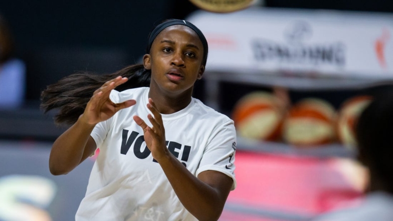 Sep 29, 2020; Bradenton, Florida, USA; Las Vegas Aces guard Jackie Young (0) warms up in a "Vote!" shirt before game 5 of the WNBA semifinals between the Connecticut Suns and the Las Vegas Aces at IMG Academy. Mandatory Credit: Mary Holt-USA TODAY Sports