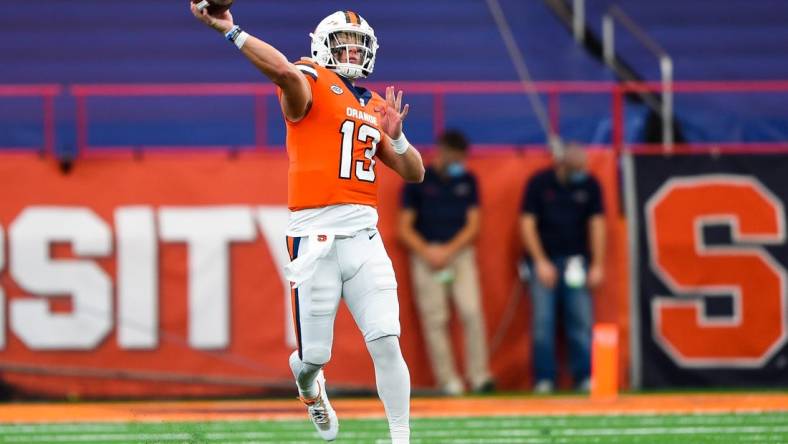 Oct 10, 2020; Syracuse, New York, USA; Syracuse Orange quarterback Tommy DeVito (13) passes the ball against the Duke Blue Devils during the second quarter at the Carrier Dome. Mandatory Credit: Rich Barnes-USA TODAY Sports