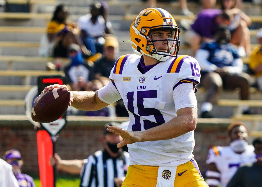 Oct 10, 2020; Columbia, Missouri, USA; LSU Tigers quarterback Myles Brennan (15) throws a pass against the Missouri Tigers during the first half at Faurot Field at Memorial Stadium. Mandatory Credit: Jay Biggerstaff-USA TODAY Sports