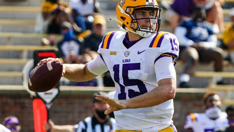 Oct 10, 2020; Columbia, Missouri, USA; LSU Tigers quarterback Myles Brennan (15) throws a pass against the Missouri Tigers during the first half at Faurot Field at Memorial Stadium. Mandatory Credit: Jay Biggerstaff-USA TODAY Sports