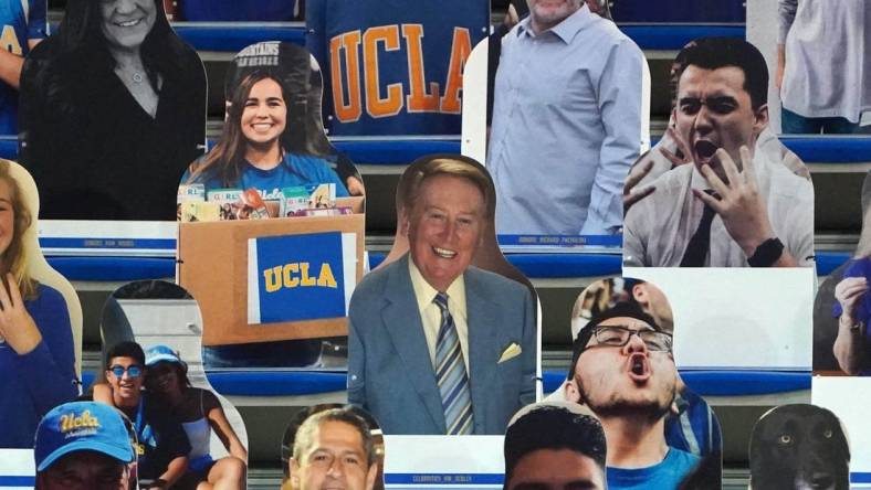 Dec 11, 2020; Los Angeles, California, USA; A fan cutout of Los Angeles Dodgers former broadcaster Vin Scully in the stands during the NCAA basketball game between the UCLA Bruins and the Marquette Golden Eagles  at Pauley Pavilion. UCLA defeated Marquette 69-60. Mandatory Credit: Kirby Lee-USA TODAY Sports