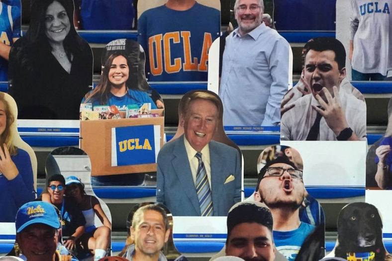 Dec 11, 2020; Los Angeles, California, USA; A fan cutout of Los Angeles Dodgers former broadcaster Vin Scully in the stands during the NCAA basketball game between the UCLA Bruins and the Marquette Golden Eagles  at Pauley Pavilion. UCLA defeated Marquette 69-60. Mandatory Credit: Kirby Lee-USA TODAY Sports