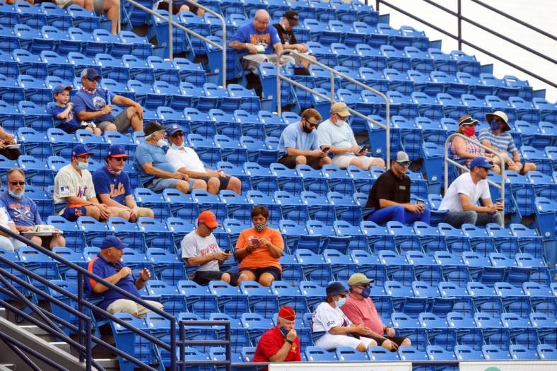 The stands at Clover Park are sparsely filled as fans begin to take their seats on Tuesday, March 2, 2021, prior to the start of the first home spring training game for the New York Mets in Port St. Lucie. Stadium capacity has been reduced by 80% and social distancing protocols are being enforced due to COVID-19 restrictions.

Tcn Mets Opening Day 03