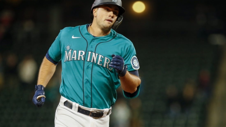 Apr 16, 2021; Seattle, Washington, USA; Seattle Mariners first baseman Evan White runs the bases after hitting a solo-home run against the Houston Astros during the eighth inning at T-Mobile Park. Mandatory Credit: Joe Nicholson-USA TODAY Sports