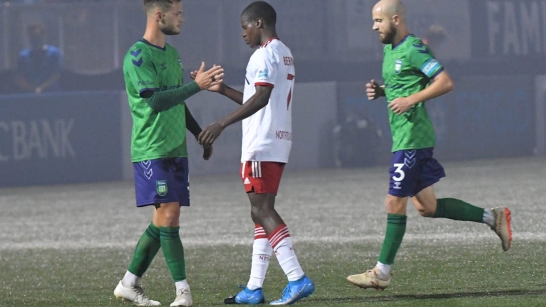 Greenville Triumph midfielder Max Hemmings(5) and North Texas SC midfielder Bernard Kamungo(7) shake hands after Greenville won 4-0 at Legacy Early College Stadium in Greenville, S.C. Saturday, May 1, 2021.Greenville Triumph Vs North Texas Sc May 1 2021