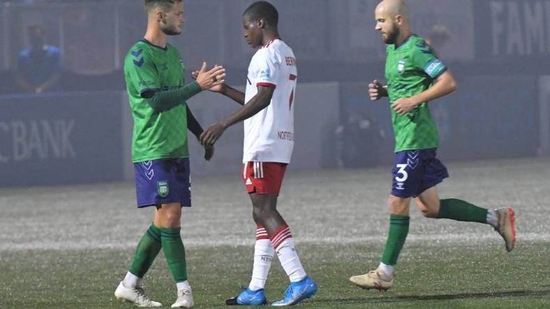 Greenville Triumph midfielder Max Hemmings(5) and North Texas SC midfielder Bernard Kamungo(7) shake hands after Greenville won 4-0 at Legacy Early College Stadium in Greenville, S.C. Saturday, May 1, 2021.

Greenville Triumph Vs North Texas Sc May 1 2021