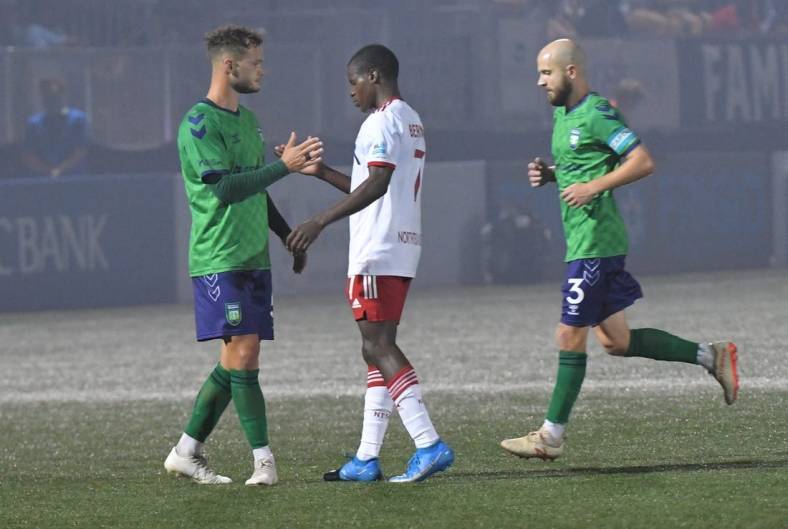 Greenville Triumph midfielder Max Hemmings(5) and North Texas SC midfielder Bernard Kamungo(7) shake hands after Greenville won 4-0 at Legacy Early College Stadium in Greenville, S.C. Saturday, May 1, 2021.

Greenville Triumph Vs North Texas Sc May 1 2021