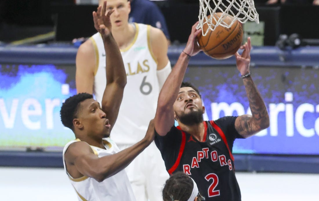 May 14, 2021; Dallas, Texas, USA;  Toronto Raptors guard Jalen Harris (2) dribbles the ball past Dallas Mavericks guard Josh Richardson (0) during the third quarter at American Airlines Center. Mandatory Credit: Kevin Jairaj-USA TODAY Sports