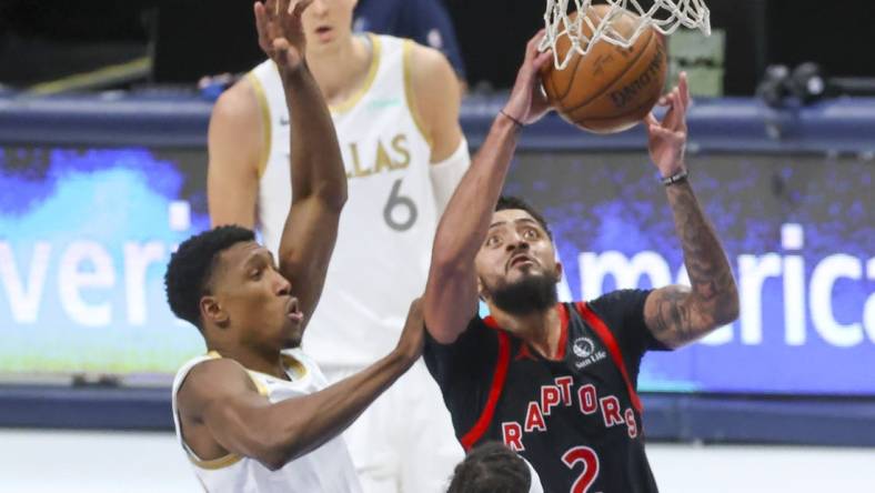 May 14, 2021; Dallas, Texas, USA;  Toronto Raptors guard Jalen Harris (2) dribbles the ball past Dallas Mavericks guard Josh Richardson (0) during the third quarter at American Airlines Center. Mandatory Credit: Kevin Jairaj-USA TODAY Sports