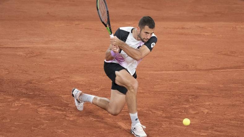 Jun 4, 2021; Paris, France;  Laslo Djere (SRB) in action during his match against Alexander Zverev (GER) on day six of the French Open at Stade Roland Garros. Mandatory Credit: Susan Mullane-USA TODAY Sports