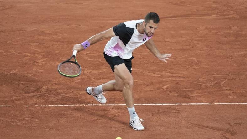 Jun 4, 2021; Paris, France;  Laslo Djere (SRB) in action during his match against Alexander Zverev (GER) on day six of the French Open at Stade Roland Garros. Mandatory Credit: Susan Mullane-USA TODAY Sports