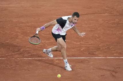 Jun 4, 2021; Paris, France;  Laslo Djere (SRB) in action during his match against Alexander Zverev (GER) on day six of the French Open at Stade Roland Garros. Mandatory Credit: Susan Mullane-USA TODAY Sports