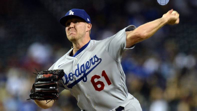 Jun 19, 2021; Phoenix, Arizona, USA; Los Angeles Dodgers relief pitcher Garrett Cleavinger (61) pitches against the Arizona Diamondbacks during the ninth inning at Chase Field. Mandatory Credit: Joe Camporeale-USA TODAY Sports