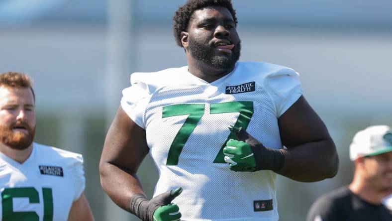 Jul 31, 2021; Florham Park, NJ, USA; New York Jets offensive tackle Mekhi Becton (77) runs during training camp at Atlantic Health Jets Training Center. Mandatory Credit: Vincent Carchietta-USA TODAY Sports