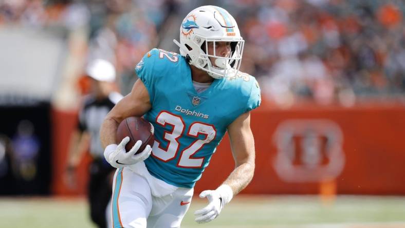 Aug 29, 2021; Cincinnati, Ohio, USA; Miami Dolphins running back Patrick Laird (32) runs during the first quarter against the Cincinnati Bengals at Paul Brown Stadium. Mandatory Credit: Joseph Maiorana-USA TODAY Sports