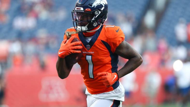 Aug 28, 2021; Denver, Colorado, USA; Denver Broncos wide receiver K.J. Hamler (1) warms up before the game against the Los Angeles Rams at Empower Field at Mile High. Mandatory Credit: C. Morgan Engel-USA TODAY Sports