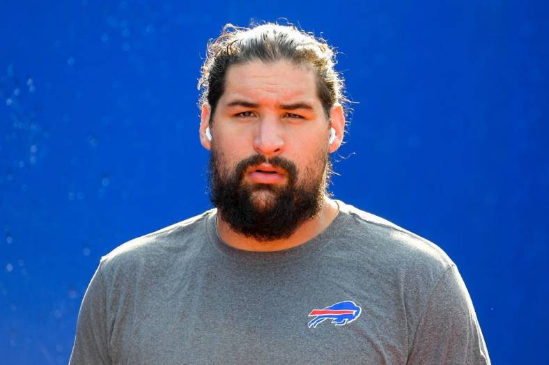 Aug 28, 2021; Orchard Park, New York, USA; Buffalo Bills offensive guard Jon Feliciano (76) walks to the field prior to the game against the Green Bay Packers at Highmark Stadium. Mandatory Credit: Rich Barnes-USA TODAY Sports