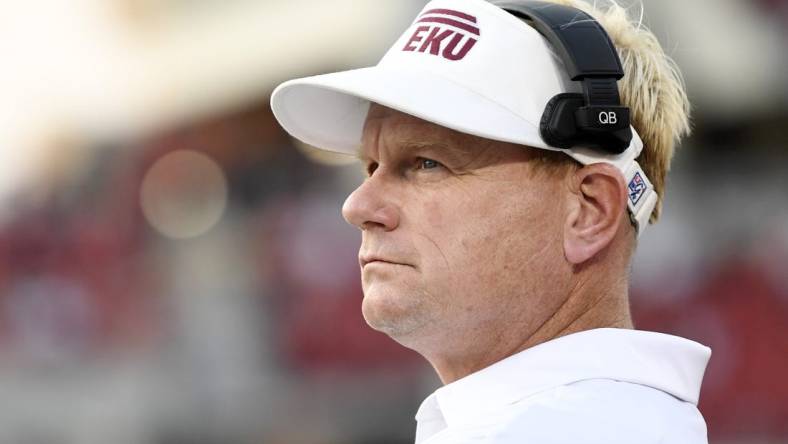 Sep 11, 2021; Louisville, Kentucky, USA; Eastern Kentucky Colonels head coach Walt Wells watches from the sideline during the first quarter against the Louisville Cardinals at Cardinal Stadium. Mandatory Credit: Jamie Rhodes-USA TODAY Sports