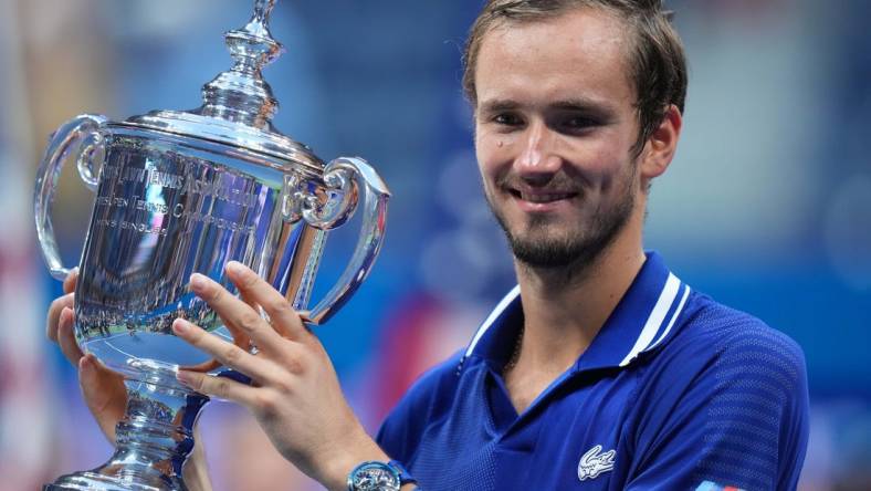 Sep 12, 2021; Flushing, NY, USA; Daniil Medvedev of Russia celebrates with the championship trophy after his match against Novak Djokovic of Serbia (not pictured) in the men's singles final on day fourteen of the 2021 U.S. Open tennis tournament at USTA Billie Jean King National Tennis Center. Mandatory Credit: Danielle Parhizkaran-USA TODAY Sports