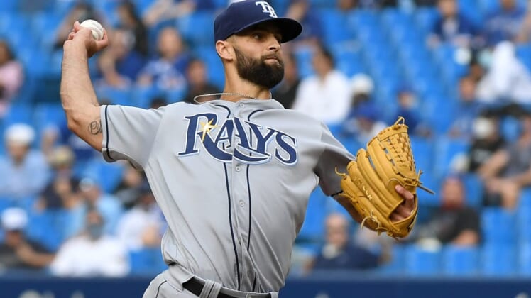 Sep 15, 2021; Toronto, Ontario, CAN;  Tampa Bay Rays relief pitcher Nick Anderson (70) delivers a pitch against Toronto Blue Jays in the eighth inning at Rogers Centre. Mandatory Credit: Dan Hamilton-USA TODAY Sports