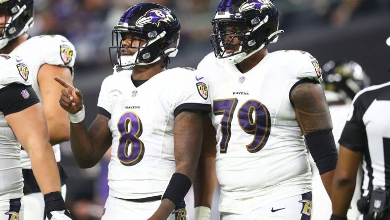 Sep 13, 2021; Paradise, Nevada, USA; Baltimore Ravens quarterback Lamar Jackson (8) and offensive tackle Ronnie Stanley (79) against the Las Vegas Raiders during Monday Night Football at Allegiant Stadium. Mandatory Credit: Mark J. Rebilas-USA TODAY Sports