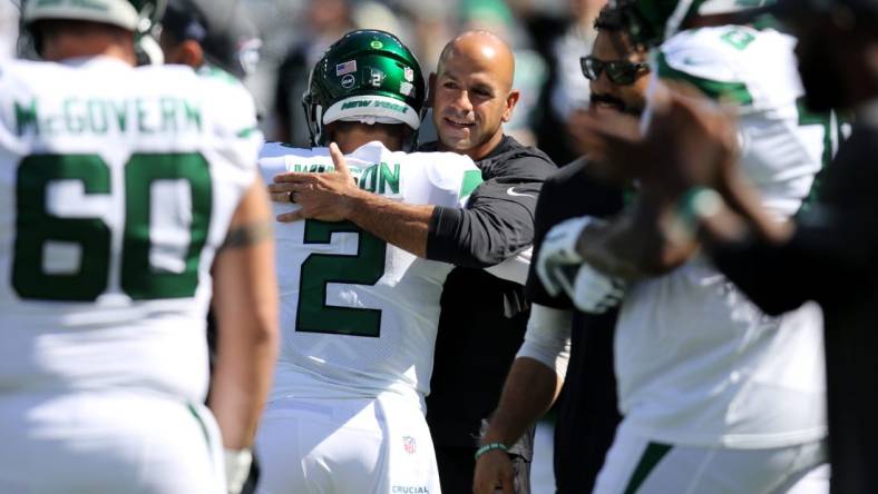 Oct 3, 2021; East Rutherford, NJ, USA;  New York Jets head coach Robert Saleh hugs quarterback Zach Wilson before the game against the Tennessee Titans at MetLife Stadium. Mandatory Credit: Kevin R. Wexler-USA TODAY Sports