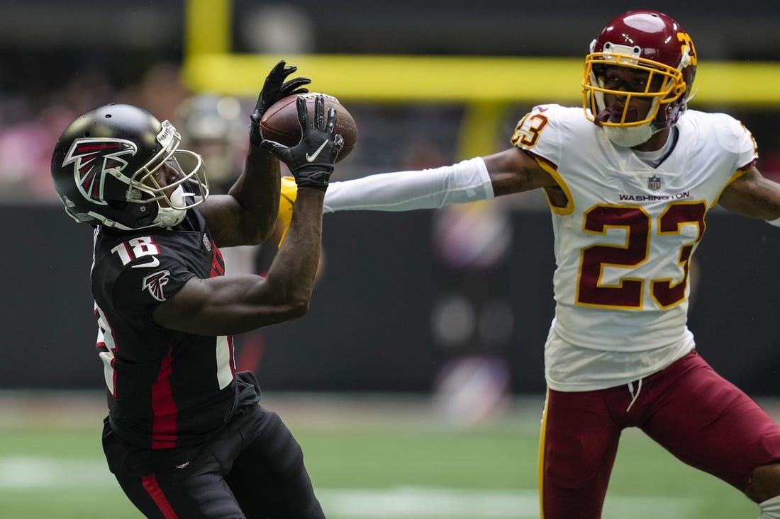 Oct 3, 2021; Atlanta, Georgia, USA; Atlanta Falcons wide receiver Calvin Ridley (18) tries to catch a pass behind Washington Football Team cornerback William Jackson III (23) during the second half at Mercedes-Benz Stadium. Mandatory Credit: Dale Zanine-USA TODAY Sports