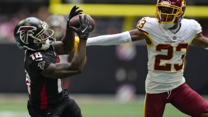 Oct 3, 2021; Atlanta, Georgia, USA; Atlanta Falcons wide receiver Calvin Ridley (18) tries to catch a pass behind Washington Football Team cornerback William Jackson III (23) during the second half at Mercedes-Benz Stadium. Mandatory Credit: Dale Zanine-USA TODAY Sports