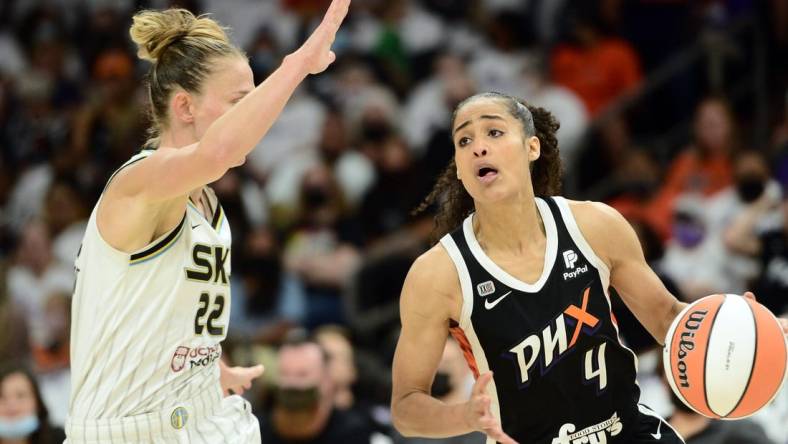 Oct 10, 2021; Phoenix, Arizona, USA; Phoenix Mercury guard Skylar Diggins-Smith (4) dribbles against Chicago Sky guard Courtney Vandersloot (22) during the first half of game one of the 2021 WNBA Finals at Footprint Center. Mandatory Credit: Joe Camporeale-USA TODAY Sports