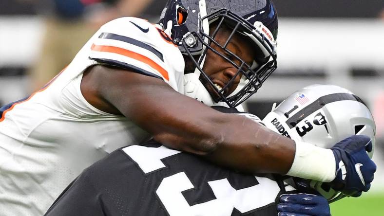 Oct 10, 2021; Paradise, Nevada, USA; Chicago Bears inside linebacker Roquan Smith (58) tackles Las Vegas Raiders wide receiver Hunter Renfrow (13) during a game at Allegiant Stadium. Mandatory Credit: Stephen R. Sylvanie-USA TODAY Sports